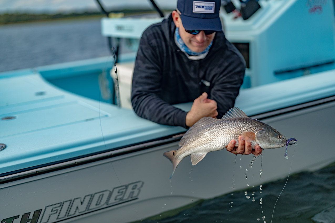 Pathfinder 2300 HPS Landing a Redfish.