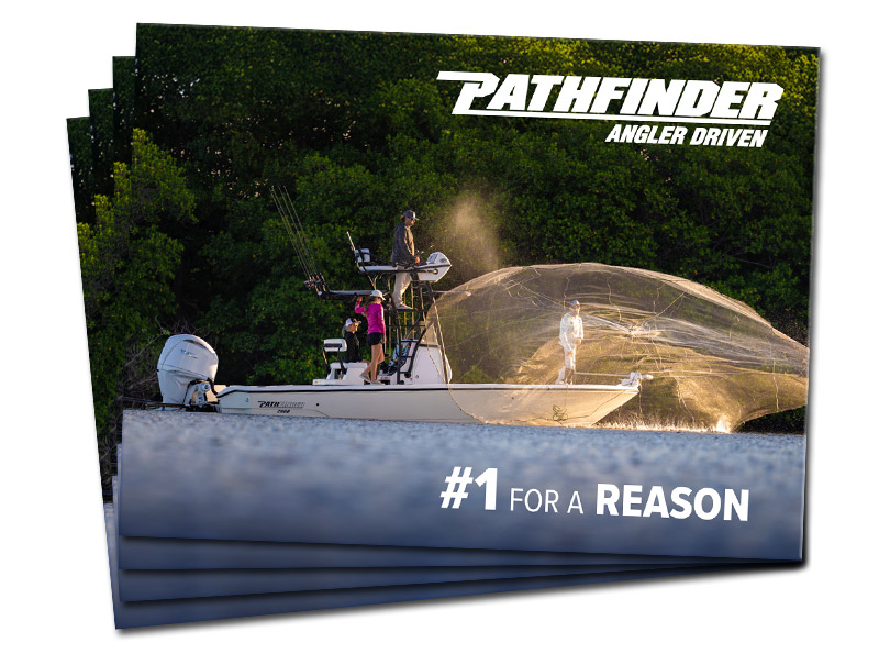 Several Pathfinder 2026 brochures fanned out, featuring the cover image of the 2600 TRS boat.