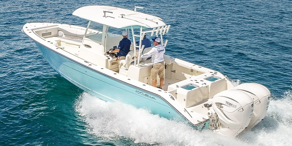Cobia 320 CC running offshore.