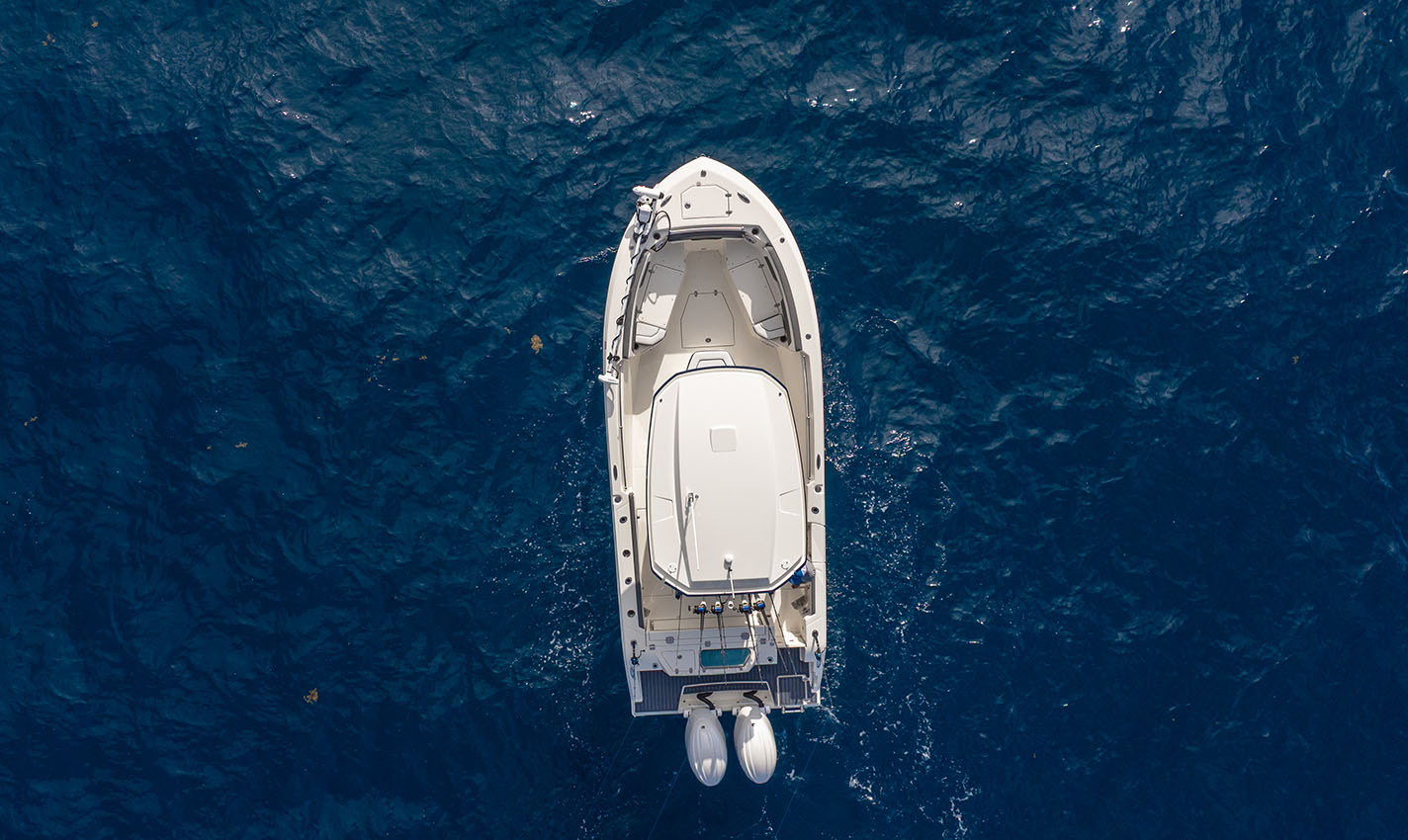 Cobia Boats 245 center console open deck layout for fishing.