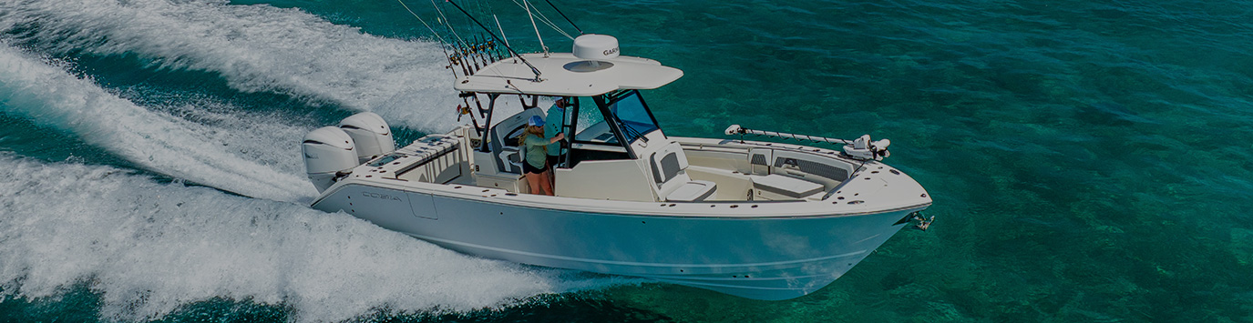 Cobia 305 CC running right.