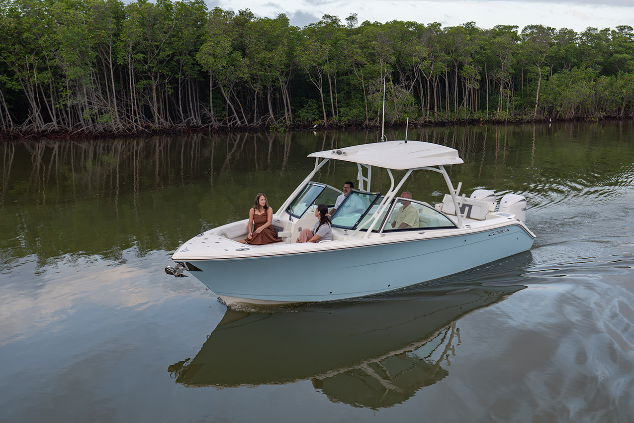 The Cobia 280 Dual Console offers generous seating, shade, and wind protection for family boating in all conditions.