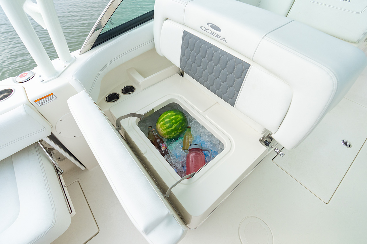 The Cobia 280 Dual Console offers a standard 100-quart under-seat cooler in the port lounge.