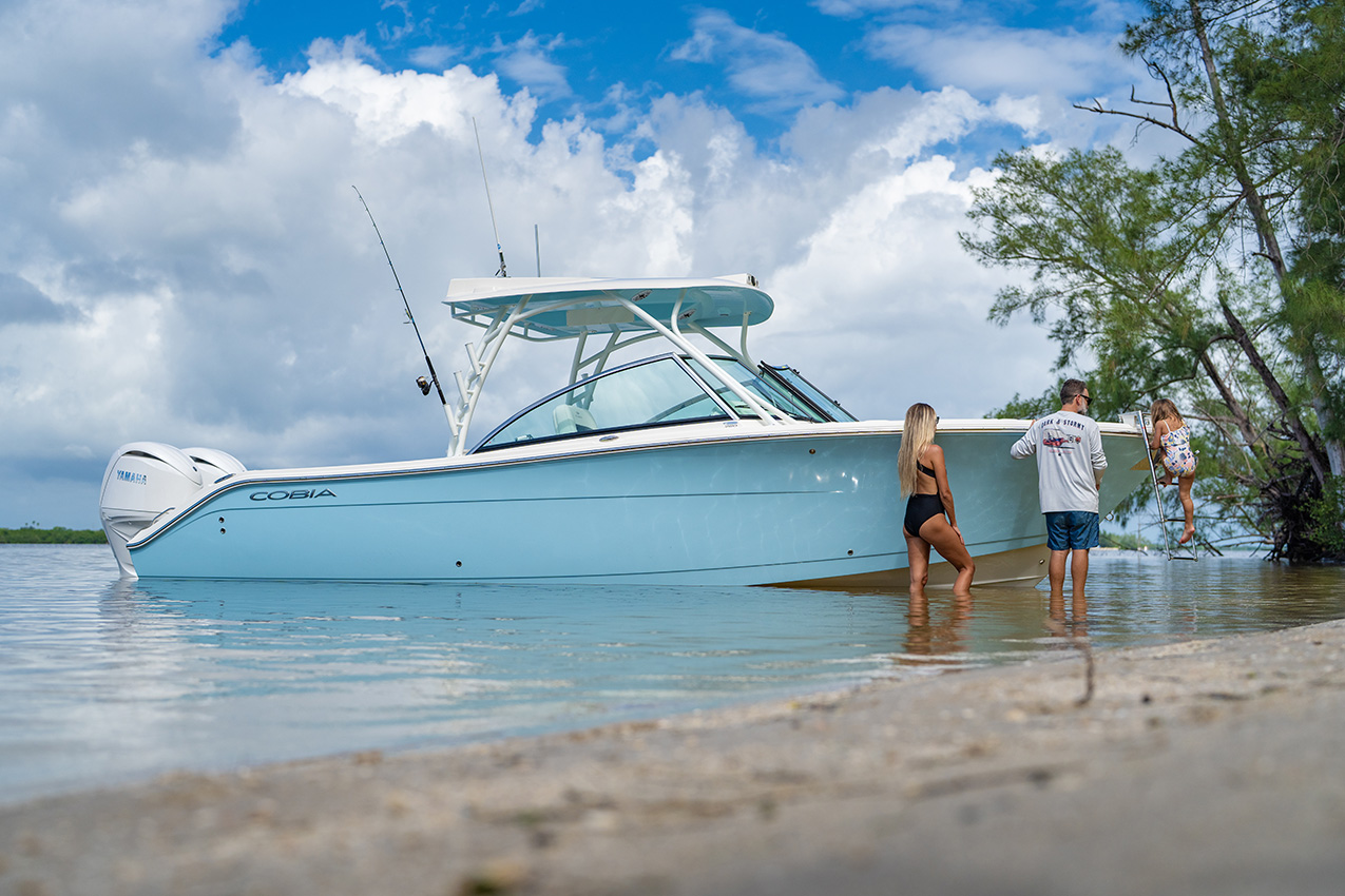 The hide-away bow ladder on the Cobia 280 Dual Console simplifies boarding from the island or sandbar.