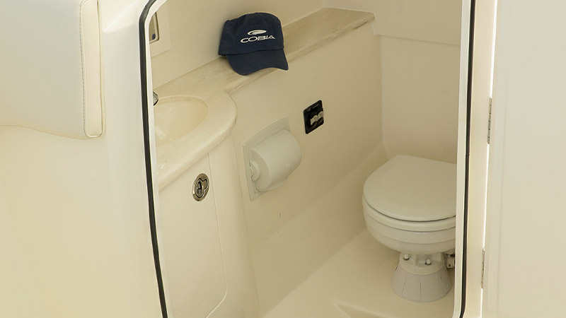 A wide aft-facing head door and fully finished interior showcase Cobia’s attention to comfort, detail, and thoughtful design.