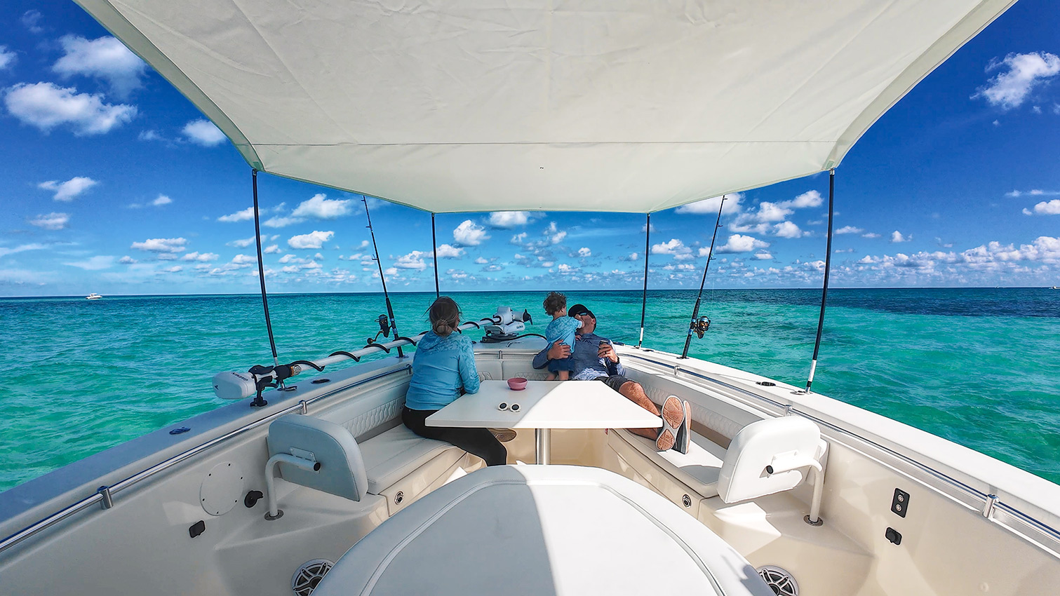 Cobia 350 CC bow seating area with family.